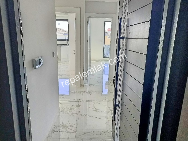 Ayvalık Güzelbahçe Evlerinde, Satılık Süper Lüks Sıfır 2+1 Daire.