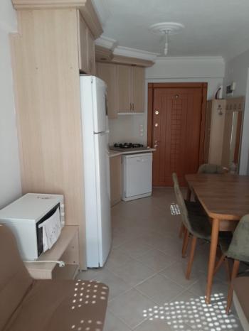 Antre Emlak'tan Eşyalı Kiralık Seaside Rezidans Gümüldür'de 2+1, Bahçeli Havuzlu  Giriş Kat Daire
