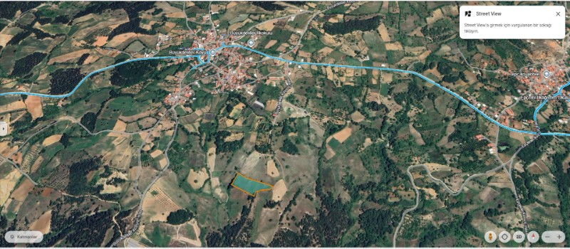 DijitalEmlak'tan Osmangazi Büyükdeliller köyünde Satılık 6.600 m2 Köye Yakın Manzaralı Tarla.