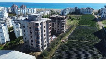 GÜZELYURT DENİZ MANZARALI 3+1 TEMELDEN DAİRELER
