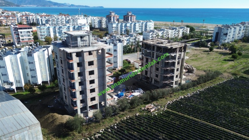 GÜZELYURT DENİZ MANZARALI 3+1 TEMELDEN DAİRELER