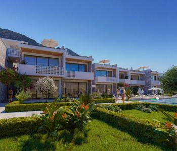 Kıbrıs Girne Lapta da Ful Deniz Manzaralı Tüm Beyaz Eşyalar ve  Klimalar Dahil Bahçe ve Üst kat 2+1 Daireler