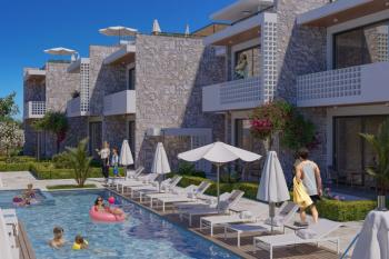 Kıbrıs Girne Lapta da Ful Deniz Manzaralı Tüm Beyaz Eşyalar ve  Klimalar Dahil Bahçe ve Üst kat 2+1 Daireler