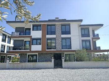 Ayvalık Güzelbahçe Evlerinde, Satılık, Lüks, Deniz Manzaralı ,1+1 Sıfır Daire.