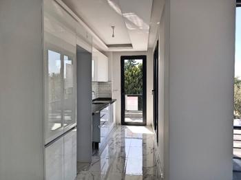 Ayvalık Güzelbahçe Evlerinde, Satılık, Lüks, Deniz Manzaralı ,1+1 Sıfır Daire.