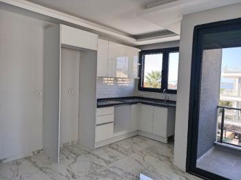 Ayvalık Güzelbahçe Evlerinde, Deniz Manzaralı, 2+1 Satılık Sıfır Lüks Daire.