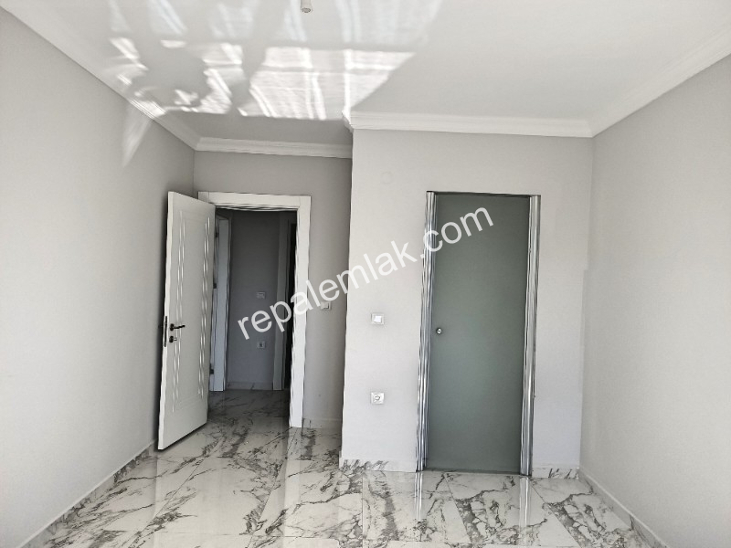 Ayvalık Güzelbahçe Evlerinde, Satılık, Lüks, Deniz Manzaralı ,1+1 Sıfır Daire.