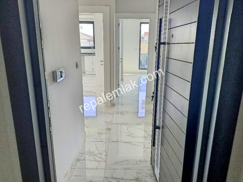 Ayvalık Güzelbahçe Evlerinde, Deniz Manzaralı, 2+1 Satılık Sıfır Lüks Daire.