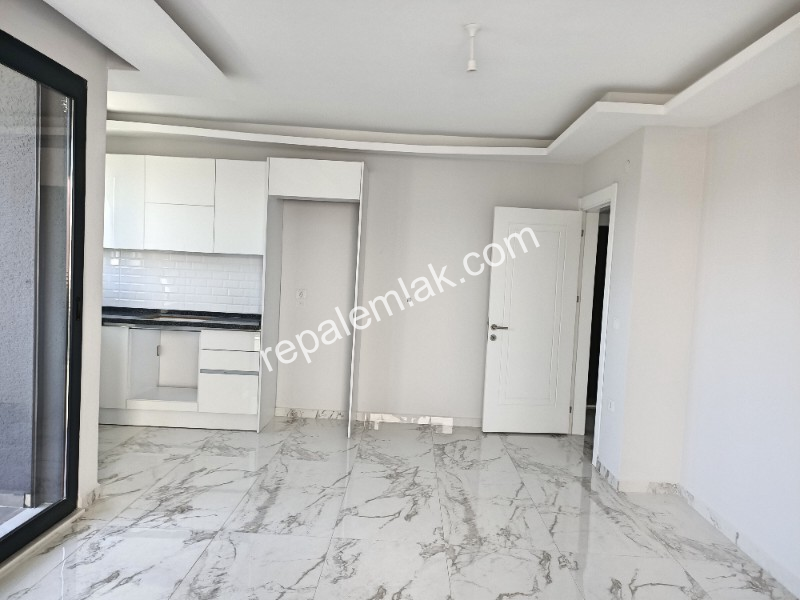 Ayvalık Güzelbahçe Evlerinde, Deniz Manzaralı, 2+1 Satılık Sıfır Lüks Daire.