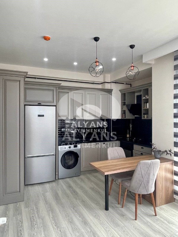 ALYANS'TAN MEZİTLİ'DE MERKEZİ KONUMDA FULL SOSYAL ALANLI 2+1