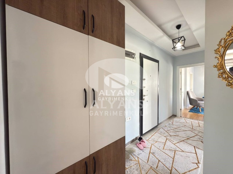 ALYANS'TAN MEZİTLİ'DE TEK BLOK OTOPARKLI FULL EŞYALI 2+1