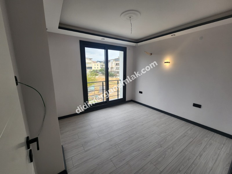 Didim Efeler Mahallesinde Merkezi Konumlu 1+1 Bahçe Katı Sıfır Daire ek - 919
