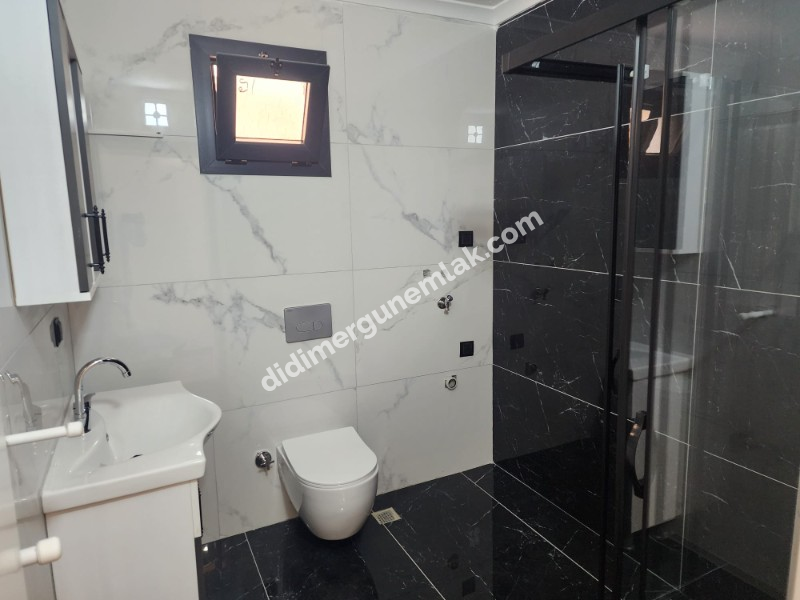 Didim Efeler Mahallesinde Merkezi Konumlu 1+1 Bahçe Katı Sıfır Daire ek - 919