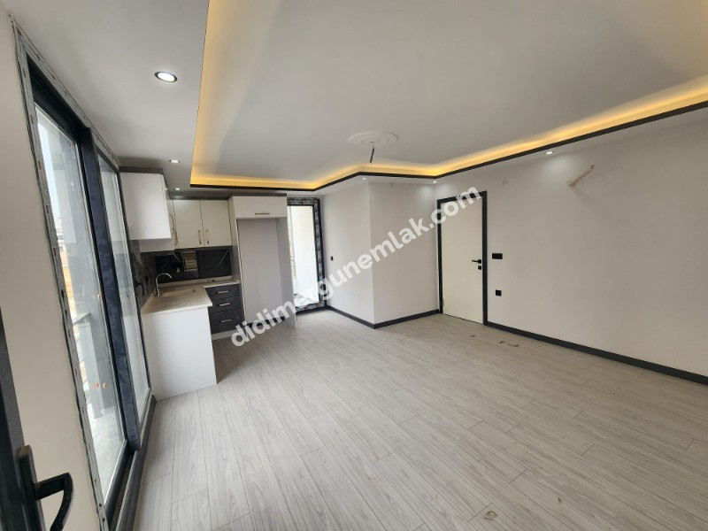 Didim Efeler Mahallesinde Merkezi Konumlu 1+1 Bahçe Katı Sıfır Daire ek - 919