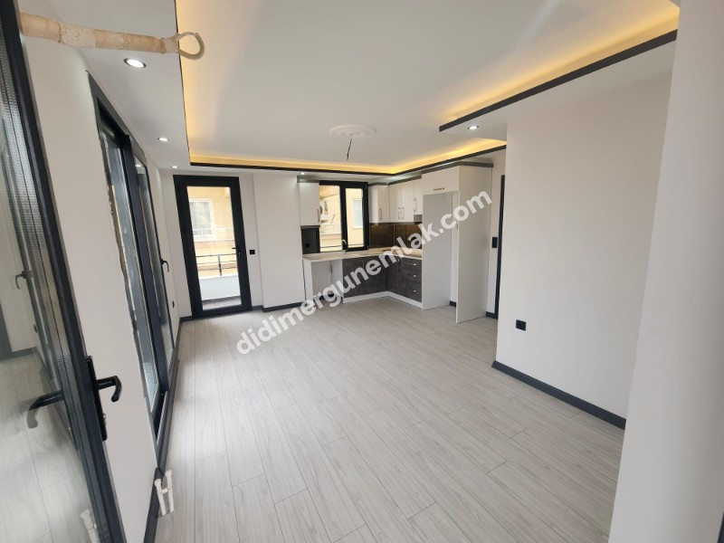 Didim Efeler Mahallesinde Merkezi Konumlu 1+1 Bahçe Katı Sıfır Daire ek - 919