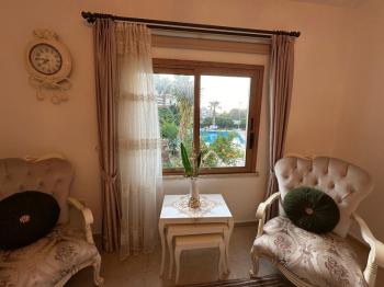 Girne Lapta Bölgesinde Satılık Site İçerisinde HAVUZLU 3+1 ZEMİN KAT Daire