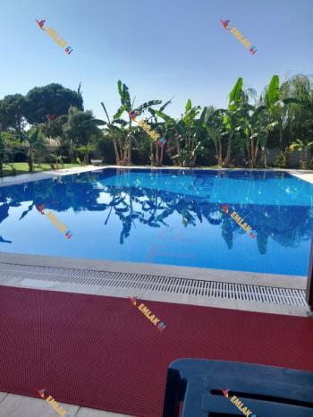 KUŞADASI DAVUTLARDA HAVUZLU SİTEDE GENİŞ DENİZ MANZARALI 2+1 SATILIK DAİRE