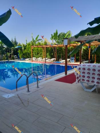 KUŞADASI DAVUTLARDA HAVUZLU SİTEDE GENİŞ DENİZ MANZARALI 2+1 SATILIK DAİRE