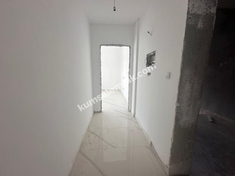 MAĞUSA MERKEZDE  YENİ SIFIR SATILIK  DAİRE 