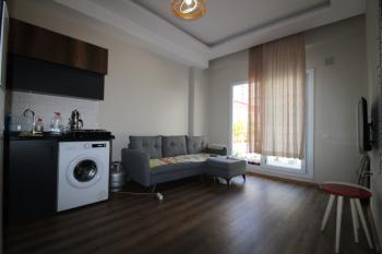 ASLAN'DAN TÖMÜK TE DENİZE 100 M MESAFEDE HAVUZLU 1+1