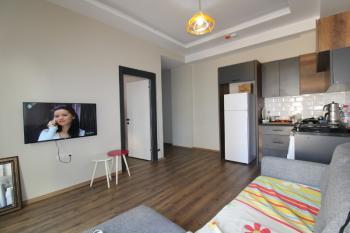 ASLAN'DAN TÖMÜK TE DENİZE 100 M MESAFEDE HAVUZLU 1+1