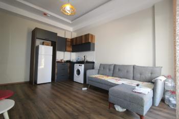 ASLAN'DAN TÖMÜK TE DENİZE 100 M MESAFEDE HAVUZLU 1+1