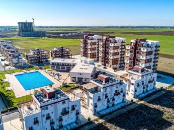 İskele Long Beach’te Denize Yürüme Mesafesinde, Ful Eşyalı,  50 Ay Vade ile Stüdyo Taşınmaya Hazır Daireler Seni Bekliyor