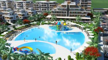 İskele Longbeach’te Denize Yürüme Mesafesinde, Ful Eşyalı, 50 Ay Vade ile  Taşınmaya Hazır 2+1 Daireler Seni Bekliyor