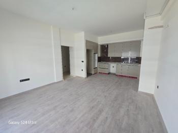 KUŞADASINDA HAVUZLU DENİZ MANZARALI KAPALI OTOPARKLI 2+1 SATILIK DAİRE