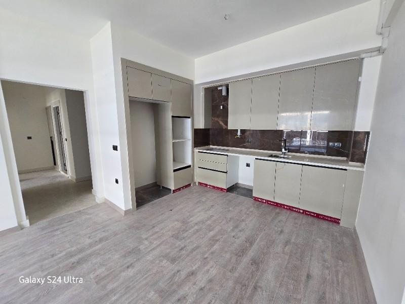 KUŞADASINDA HAVUZLU DENİZ MANZARALI KAPALI OTOPARKLI 2+1 SATILIK DAİRE