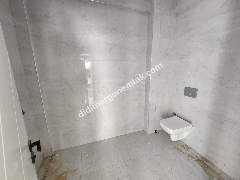 CUMHURİYET MAHALLESİ'NDE TATİL KÖYÜ KONFORUNDA SIFIR 2+1 SATILIK DAİRE