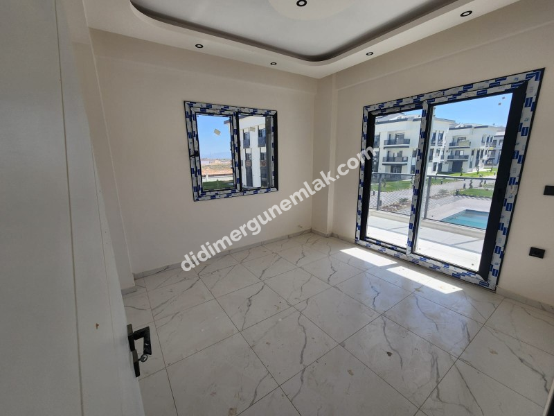 CUMHURİYET MAHALLESİ'NDE TATİL KÖYÜ KONFORUNDA SIFIR 2+1 SATILIK DAİRE