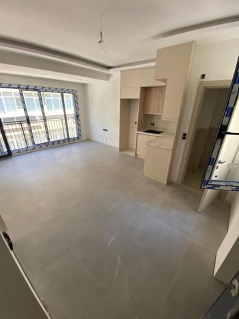 KUŞADASI Çarşı Merkezde 1+1 Sıfır Satılık Daire