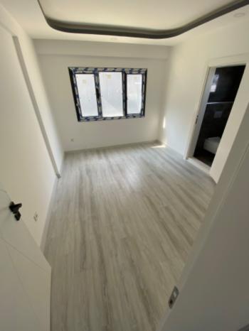 KUŞADASI Değirmendere'de Satılık Sıfır Deniz Manzaralı 2+1 Bahçe Katı!!!