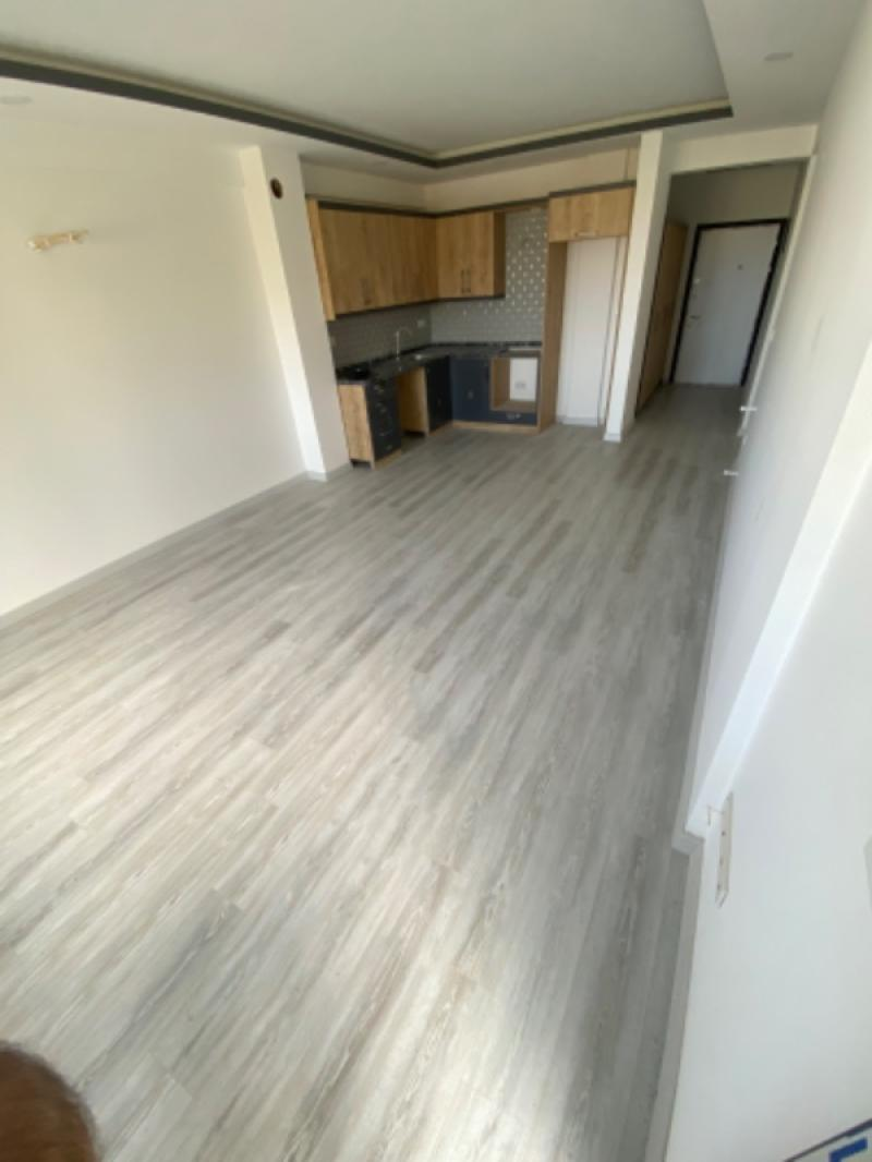 KUŞADASI Değirmendere'de Satılık Sıfır Deniz Manzaralı 2+1 Bahçe Katı!!!