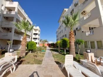 DİDİM ÇAMLIK MAHALLESİ’NDE,EŞYALI, HAVUZ CEPHELİ, DENİZE YÜRÜME MESAFESİNDE SATILIK 2+1 DAİRE