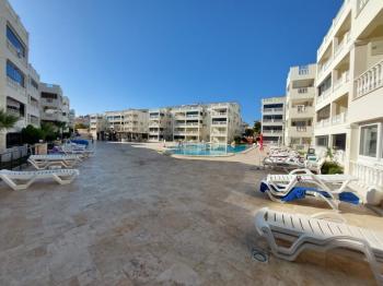 DİDİM ÇAMLIK MAHALLESİ’NDE,EŞYALI, HAVUZ CEPHELİ, DENİZE YÜRÜME MESAFESİNDE SATILIK 2+1 DAİRE