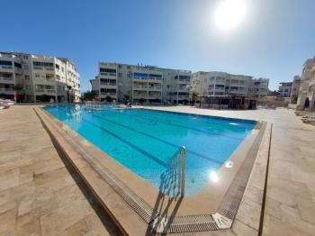 DİDİM ÇAMLIK MAHALLESİ’NDE,EŞYALI, HAVUZ CEPHELİ, DENİZE YÜRÜME MESAFESİNDE SATILIK 2+1 DAİRE