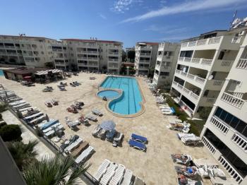 DİDİM ÇAMLIK MAHALLESİ’NDE,EŞYALI, HAVUZ CEPHELİ, DENİZE YÜRÜME MESAFESİNDE SATILIK 2+1 DAİRE