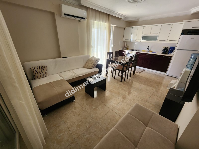 DİDİM ÇAMLIK MAHALLESİNDE DENİZE YAKIN MASRAFSIZ GENİS TERASLI 3+1 SATILIK DUBLEKS