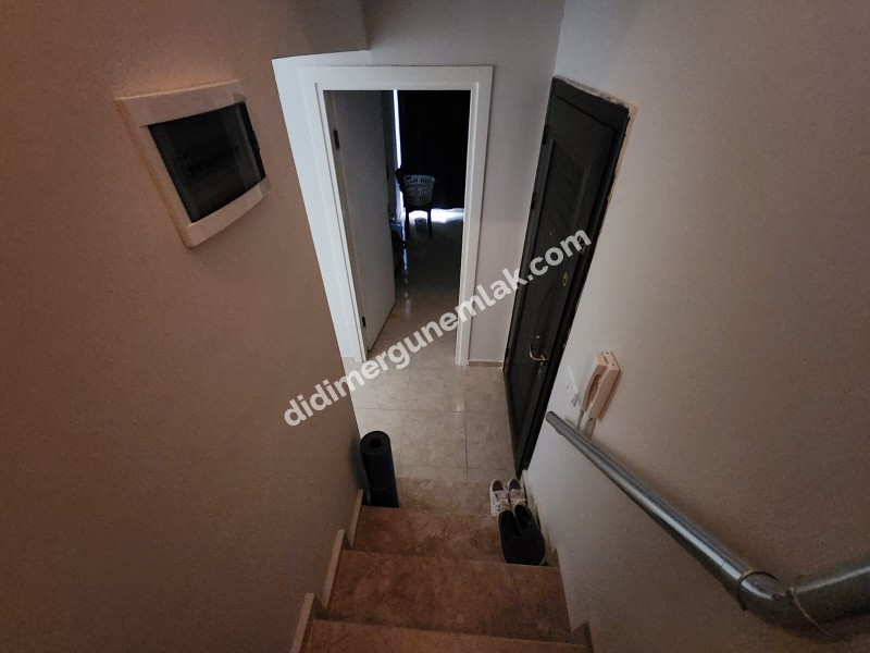 DİDİM ÇAMLIK MAHALLESİNDE DENİZE YAKIN MASRAFSIZ GENİS TERASLI 3+1 SATILIK DUBLEKS