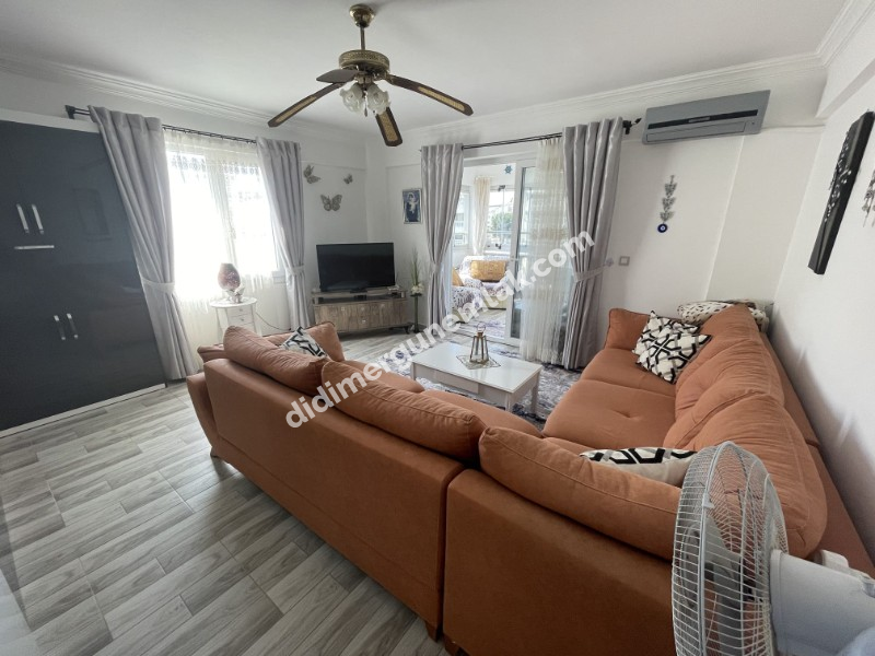 DİDİM ÇAMLIK MAHALLESİ’NDE,EŞYALI, HAVUZ CEPHELİ, DENİZE YÜRÜME MESAFESİNDE SATILIK 2+1 DAİRE