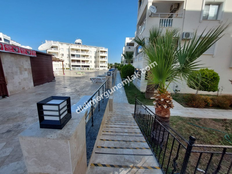 DİDİM ÇAMLIK MAHALLESİ’NDE,EŞYALI, HAVUZ CEPHELİ, DENİZE YÜRÜME MESAFESİNDE SATILIK 2+1 DAİRE