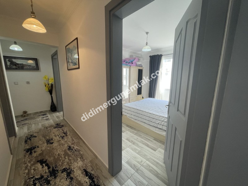 DİDİM ÇAMLIK MAHALLESİ’NDE,EŞYALI, HAVUZ CEPHELİ, DENİZE YÜRÜME MESAFESİNDE SATILIK 2+1 DAİRE