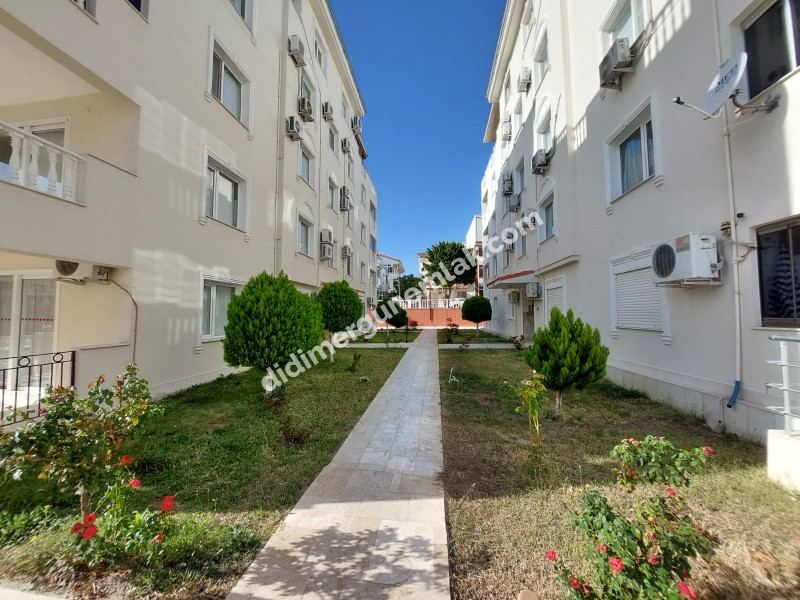 DİDİM ÇAMLIK MAHALLESİ’NDE,EŞYALI, HAVUZ CEPHELİ, DENİZE YÜRÜME MESAFESİNDE SATILIK 2+1 DAİRE