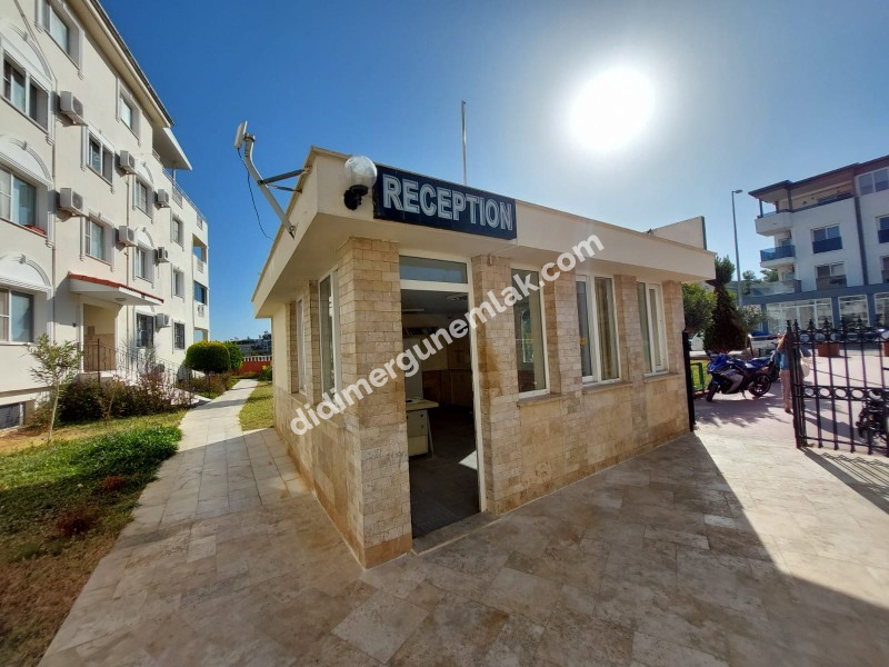 DİDİM ÇAMLIK MAHALLESİ’NDE,EŞYALI, HAVUZ CEPHELİ, DENİZE YÜRÜME MESAFESİNDE SATILIK 2+1 DAİRE