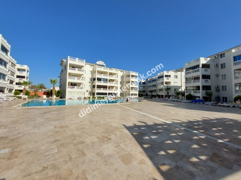 DİDİM ÇAMLIK MAHALLESİ’NDE,EŞYALI, HAVUZ CEPHELİ, DENİZE YÜRÜME MESAFESİNDE SATILIK 2+1 DAİRE