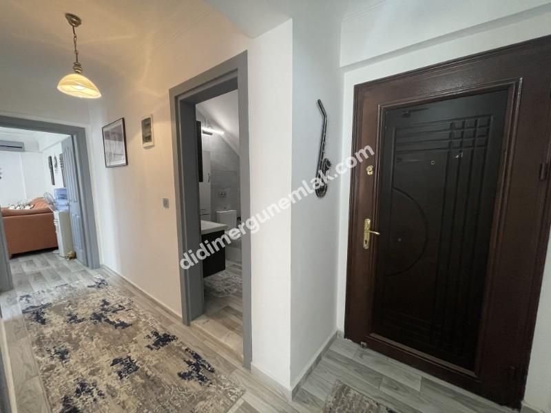 DİDİM ÇAMLIK MAHALLESİ’NDE,EŞYALI, HAVUZ CEPHELİ, DENİZE YÜRÜME MESAFESİNDE SATILIK 2+1 DAİRE