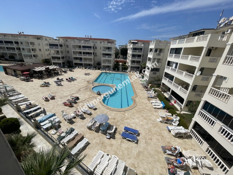 DİDİM ÇAMLIK MAHALLESİ’NDE,EŞYALI, HAVUZ CEPHELİ, DENİZE YÜRÜME MESAFESİNDE SATILIK 2+1 DAİRE