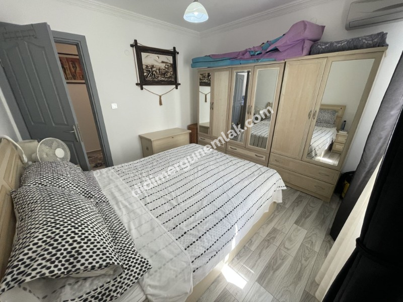 DİDİM ÇAMLIK MAHALLESİ’NDE,EŞYALI, HAVUZ CEPHELİ, DENİZE YÜRÜME MESAFESİNDE SATILIK 2+1 DAİRE